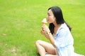 Chinese Portrait of young happy woman eating ice-cream Royalty Free Stock Photo