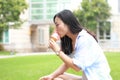 Chinese Portrait of young happy woman eating ice-cream Royalty Free Stock Photo