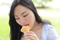 Chinese Portrait of young happy woman eating ice-cream Royalty Free Stock Photo