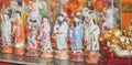 Chinese pottery doll. A roll of traditional Chinese pottery dolls - common home decorations and souvenirs with soft focus on the
