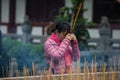 Chinese praying at temple, Guangzhou, China