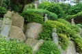 Chinese priest stone sculptures in the garden of Haedong Yonggungsa Temple