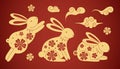 Chinese rabbit set. Golden traditional New Year zodiac animal, clouds and flowers, gold bunny silhouette on red background, 2023