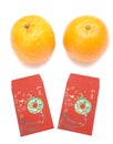 Chinese Red Envelopes and a pair of mandarin oranges for lunar new year celebrations