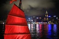 Chinese red junk with the victoria harbor night view background Royalty Free Stock Photo
