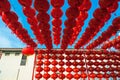 Chinese red lanterns hanging in street againt blue sky for decoration during the Chinese New Year festival at Chinatown, Ratchabur Royalty Free Stock Photo