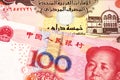 A Chinese renminbi one hundred yuan note with cash from the United Arab Emirates in macro