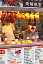 Cook works in a take-away Chinese restaurant, chicken and Peking duck,Hongkong