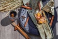 Chinese rice dumpling shaped pyramidal wrapped by leaves ingredients on dried banana leaf Royalty Free Stock Photo