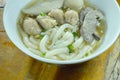 Chinese rice flour noodles topping minced pork and liver with fish ball in soup on bowl Royalty Free Stock Photo