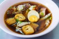 Chinese roll noodles soup with pork and egg