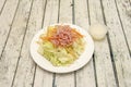 Chinese salad with iceberg lettuce, grated carrots, lots of grated cooked ham, Royalty Free Stock Photo