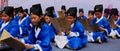 Chinese schoolchild wearing folk clothes studying ancient style prose Royalty Free Stock Photo