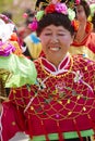 Chinese senior woman in colorful traditional silk cloth dancing