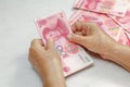 Chinese Senior woman counting money for payment Royalty Free Stock Photo