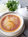 Chinese Shark`s Fin Soup with crab meat, sea cucumber and conch in brown soup. Royalty Free Stock Photo