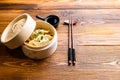 Chinese snacks. chinese steamed dumpling. Chinese Traditional cuisine concept. in wooden steamer soy sauce and chopsticks side Royalty Free Stock Photo