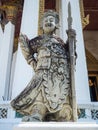 Chinese standing giant carved out of rock in Wat Suthat Thep War