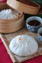 Chinese Steamed Bun and Cup of Tea Royalty Free Stock Photo