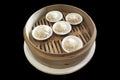 Chinese steamed bun Xiaolongbao isolated on black backgroud. Royalty Free Stock Photo