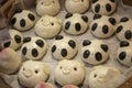 Chinese steamed buns or mantou made in the form of animals- pandas and pigs Royalty Free Stock Photo