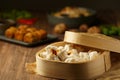 Chinese Steamed buns with red minced pork on a plate and bamboo baskets. Asian Food chinese traditional food cuisine Royalty Free Stock Photo