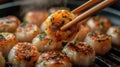 A chinese steamed dumpling held with chopsticks Royalty Free Stock Photo
