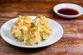 Chinese Steamed Dumpling, Shumai on white dish served with soy sauce on wooden table. Delicious Dimsum pork Royalty Free Stock Photo