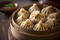 Chinese steamed dumplings in bamboo steamer on wooden table