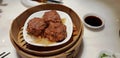 Chinese steamed meatballs in bamboo steamer