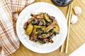 Stir-fried of chicken with zucchini in plate on board top Royalty Free Stock Photo