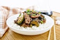 Stir-fried of chicken with zucchini in plate on board Royalty Free Stock Photo