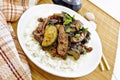 Stir-fried of chicken with zucchini in plate on light board Royalty Free Stock Photo