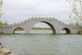 A Chinese stone arch bridge over the river Royalty Free Stock Photo