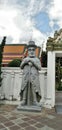 Chinese stone statue guarding the entrance in Wat Pho, Bangkok,