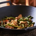Chinese string bean chicken in cast iron wok Royalty Free Stock Photo