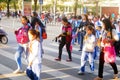 Chinese students home after school through traffic intersection