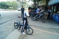 Chinese students riding a bicycle in the street