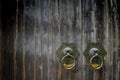 Chinese Style ancient door metal knocker handle , mottled and brass wooden door knocker with copy space Royalty Free Stock Photo