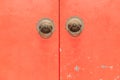 Chinese Style of Brass Ring Pull Handles on Red Door