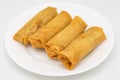 Chinese Style Crispy Vegetarian Spring Rolls on a White Plate