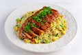 Chinese style Egg fried rice with sliced pork fillet on white wooden table. Royalty Free Stock Photo