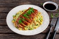 Chinese style Egg fried rice with sliced pork fillet on wooden table. Royalty Free Stock Photo