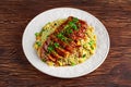 Chinese style Egg fried rice with sliced pork fillet on wooden table. Royalty Free Stock Photo