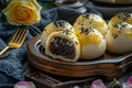 Chinese style oil pastries, small round steamed buns with yellow glaze and black seeds on top Royalty Free Stock Photo