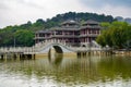 Chinese style pedestrian stone arch bridge over lake in park Royalty Free Stock Photo