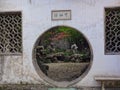 The Chinese style round door made of bricks in a garden