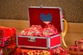 Chinese style safe furniture for wedding. Luxury red handle box on wood table. Royalty Free Stock Photo