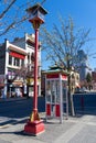 Chinese style telephone booth and street light in Victoria Chinatown. Royalty Free Stock Photo