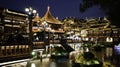 Chinese-style wooden buildings in Shanghai Yu Garden illuminated by lights